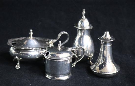 Four assorted silver condiments.